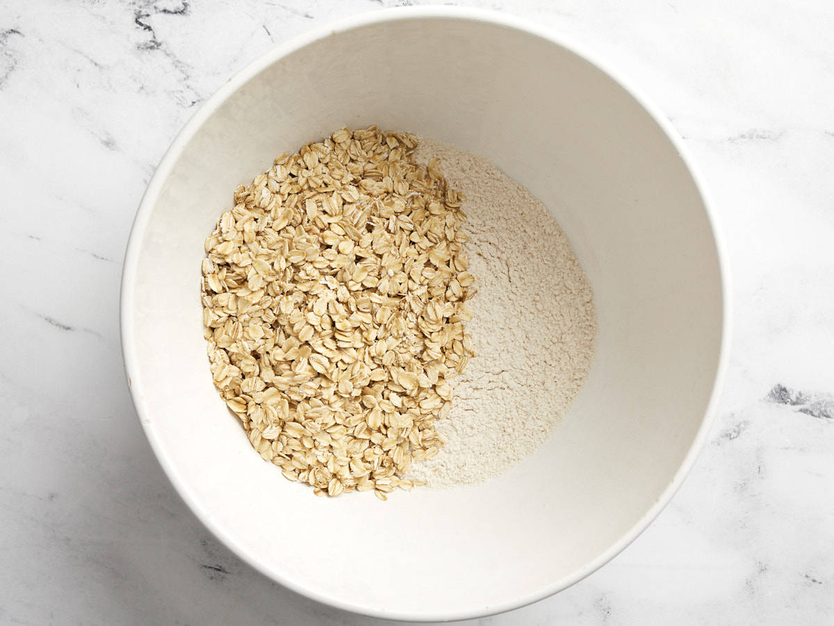 Oats mixed with flour in a bowl.