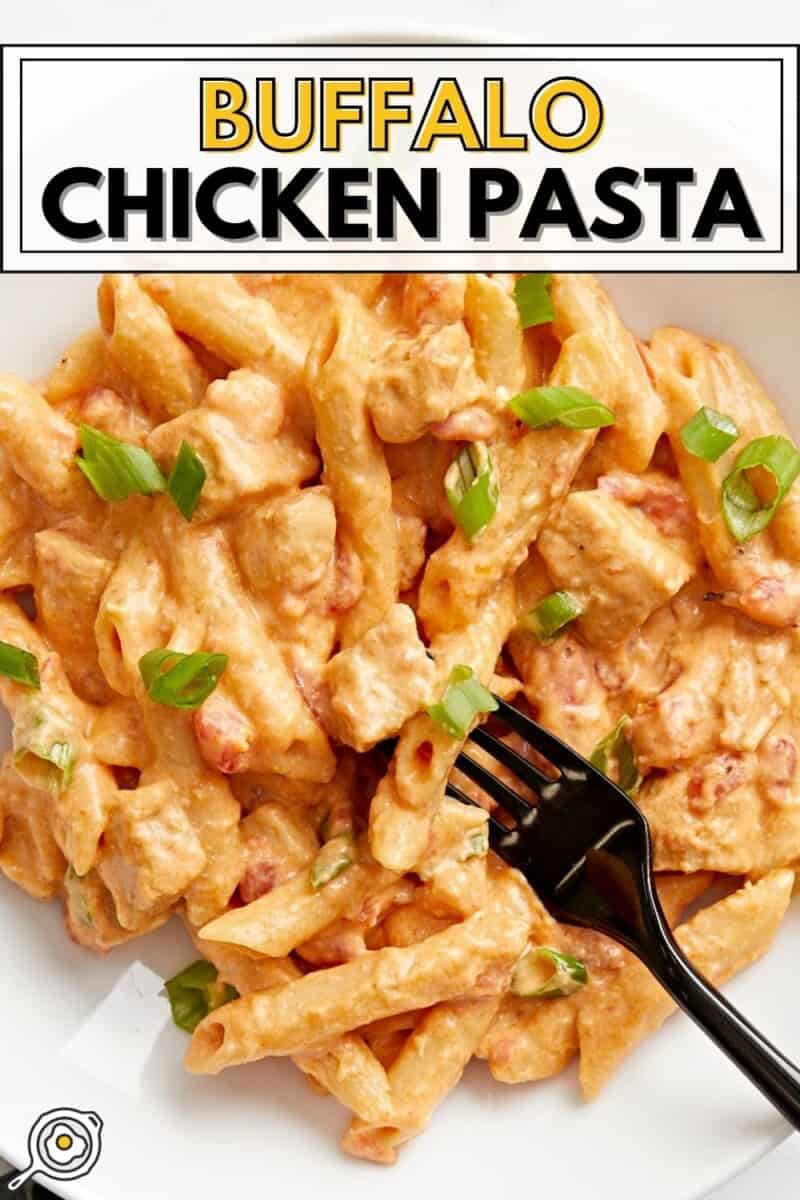 Close up overhead view of a bowl of buffalo chicken pasta with a fork.