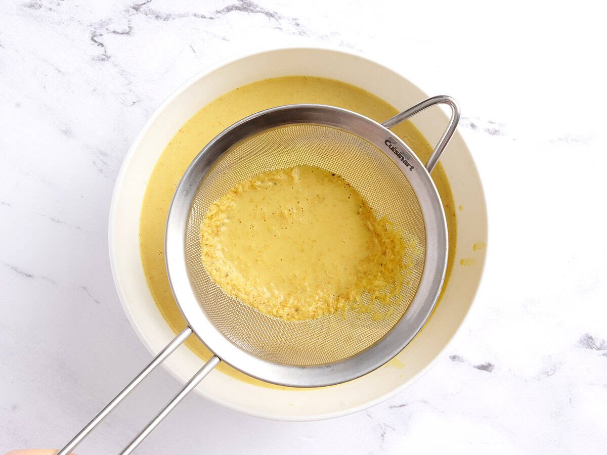 Straining the golden milk.