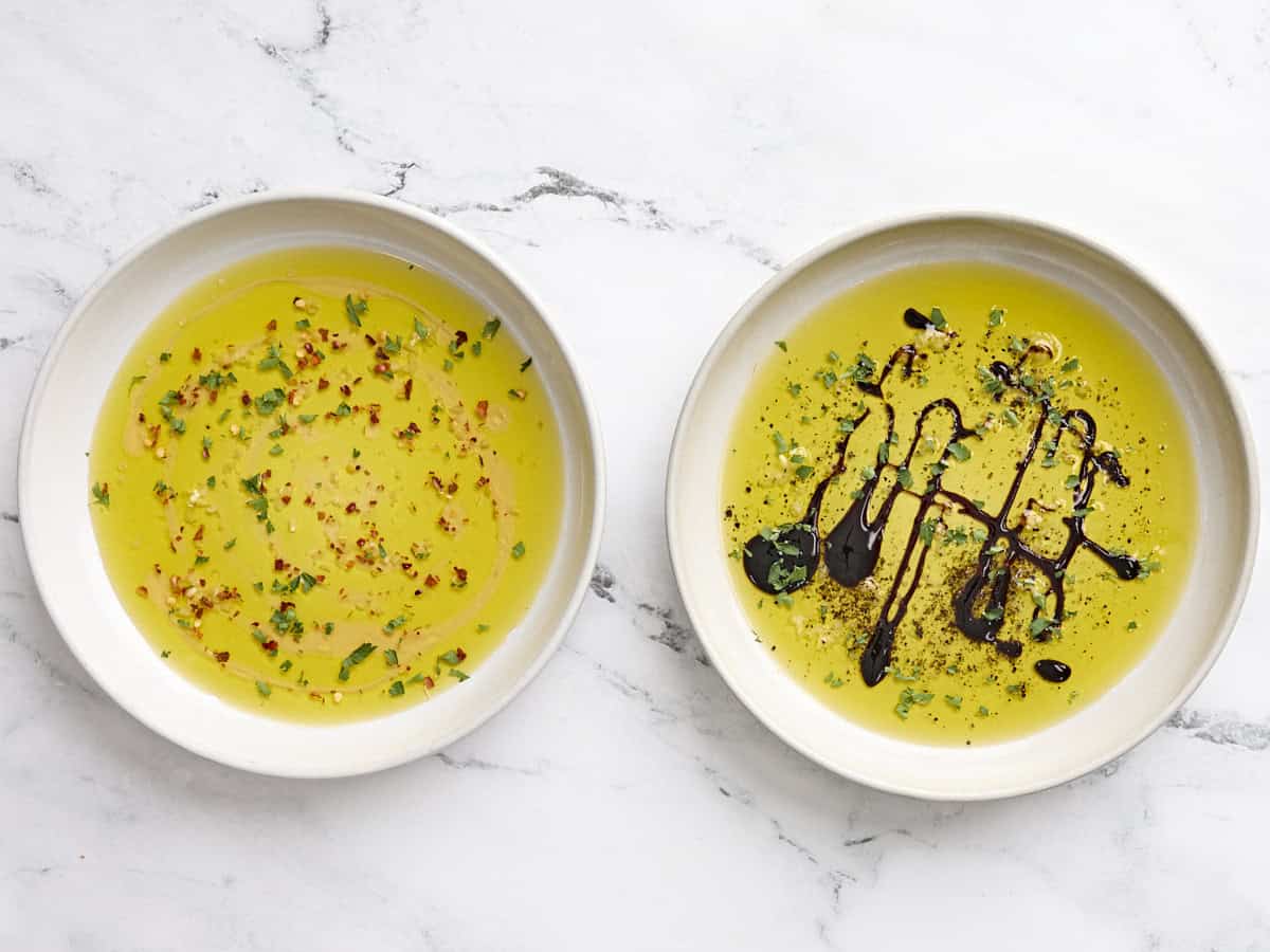 Two white bowls of the finished dips.