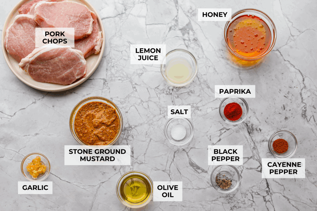 Overhead shot of labeled honey mustard pork chops ingredients.