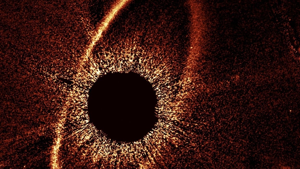 Hubble observing dust clouds and ring around star Fomalhaut