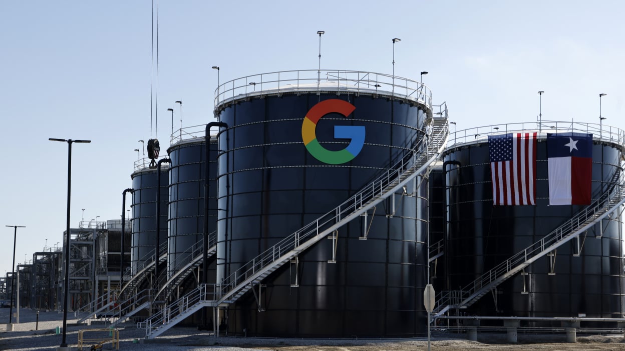 Two large metal structures emblazoned with the Google logo and the Texas state flag.