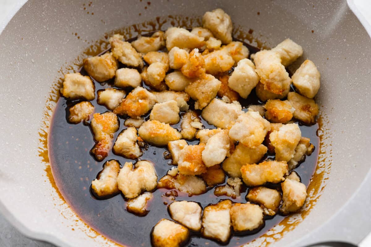 Cooked chicken added to the sauce in the skillet.