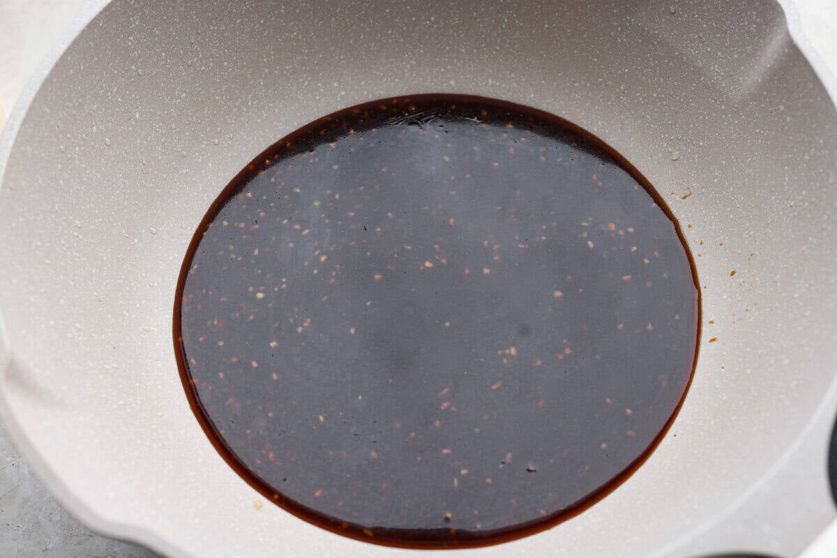 One pan general Tso's sauce added to the skillet.