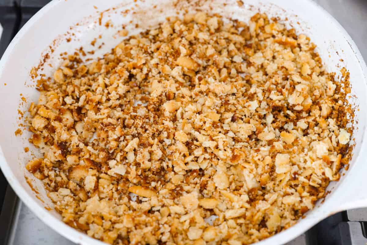 If you love my classic poppyseed chicken casserole, this crockpot poppyseed chicken is the easiest way to make it. Same creamy, buttery flavor. Same cozy comfort. Butter and crushed Ritz crackers cooking on a skillet.