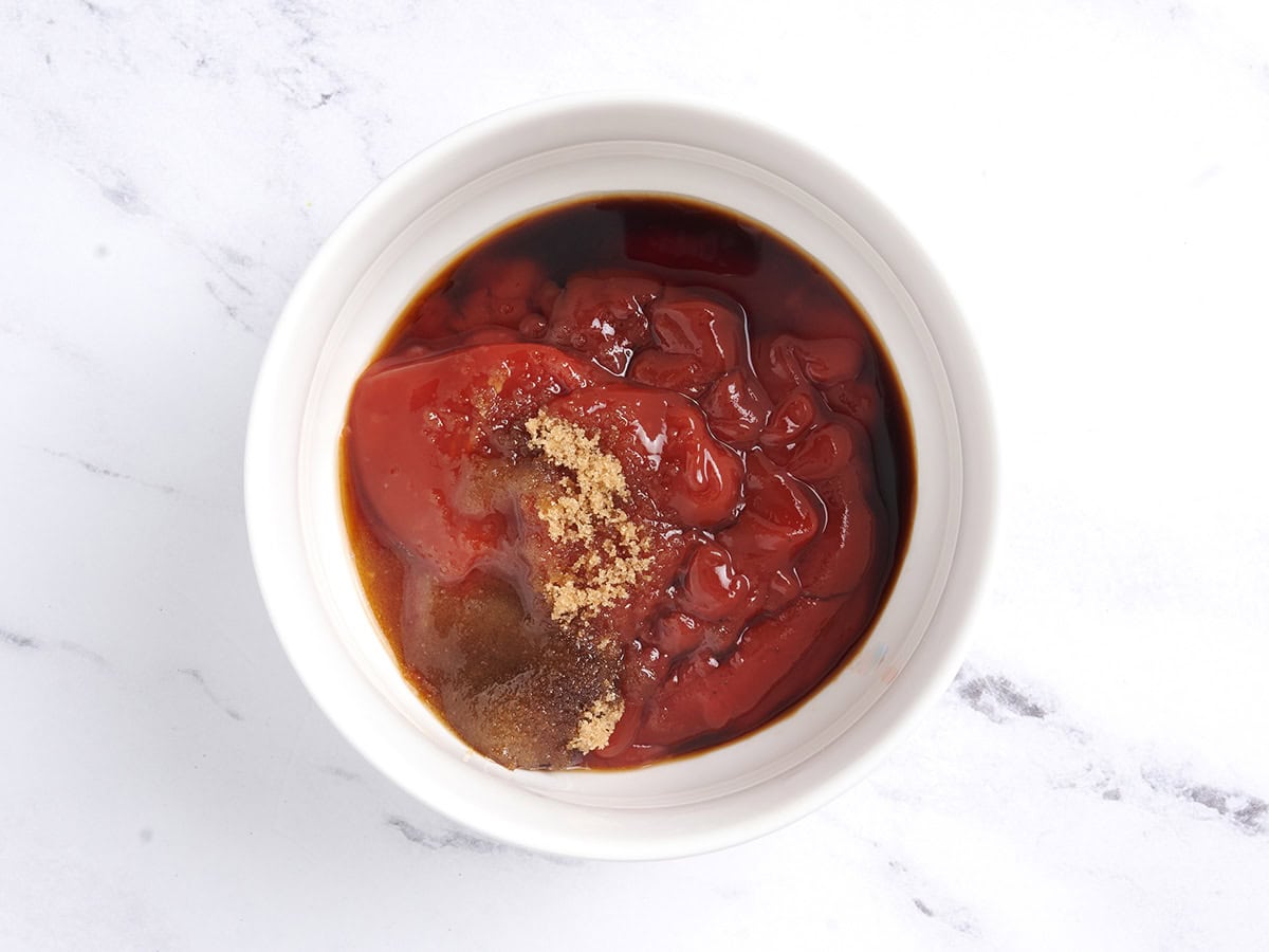 Ingredients for the sauce in a white bowl.