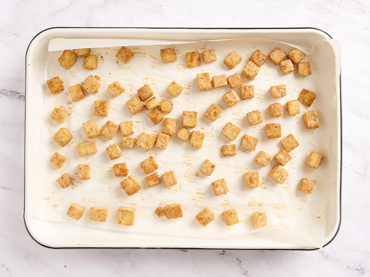 Baked tofu on a baking tray.