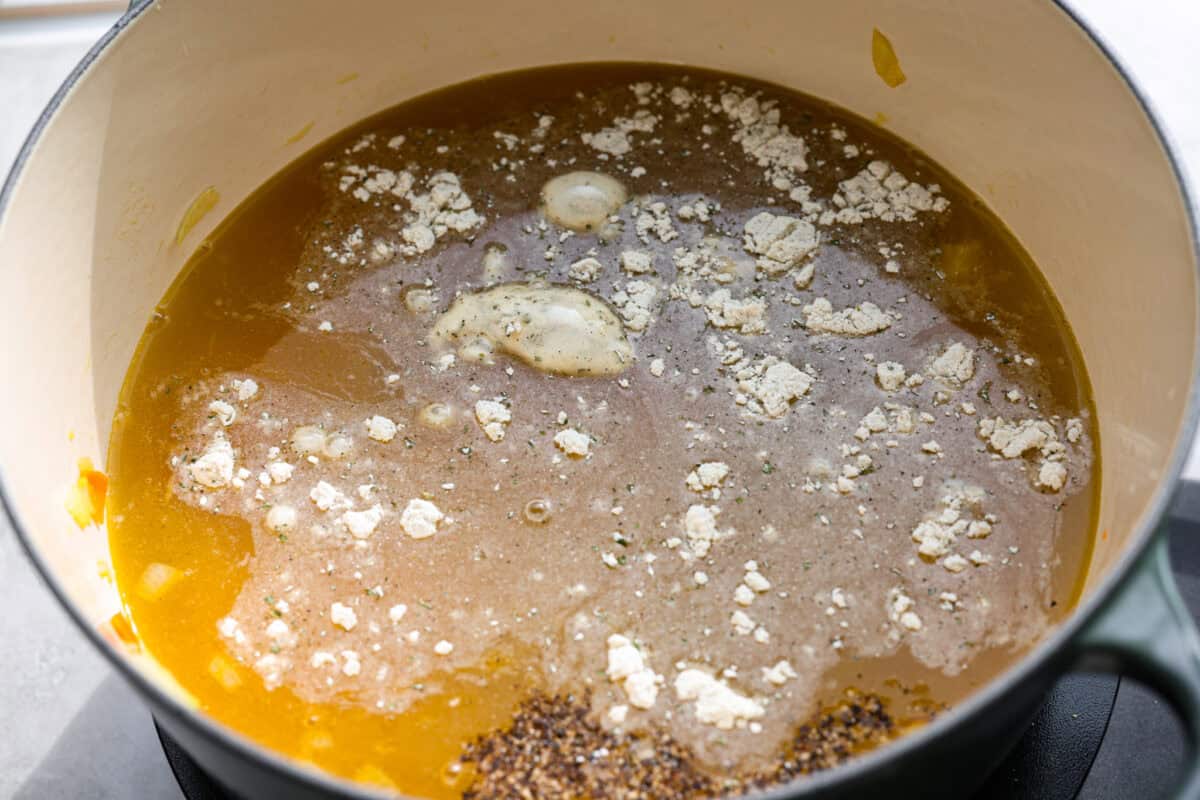Stop what you are doing right now, and make this Crack Chicken and Rice soup! With tender chicken, rice, creamy cheese, crispy bacon, and bold ranch flavor, this easy one pot recipe tastes like pure comfort in every spoonful. Broth and seasoning added to the pot.