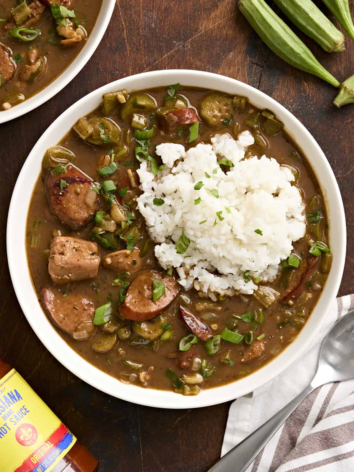 Overhead view of a bowl of gumbo and rice.
