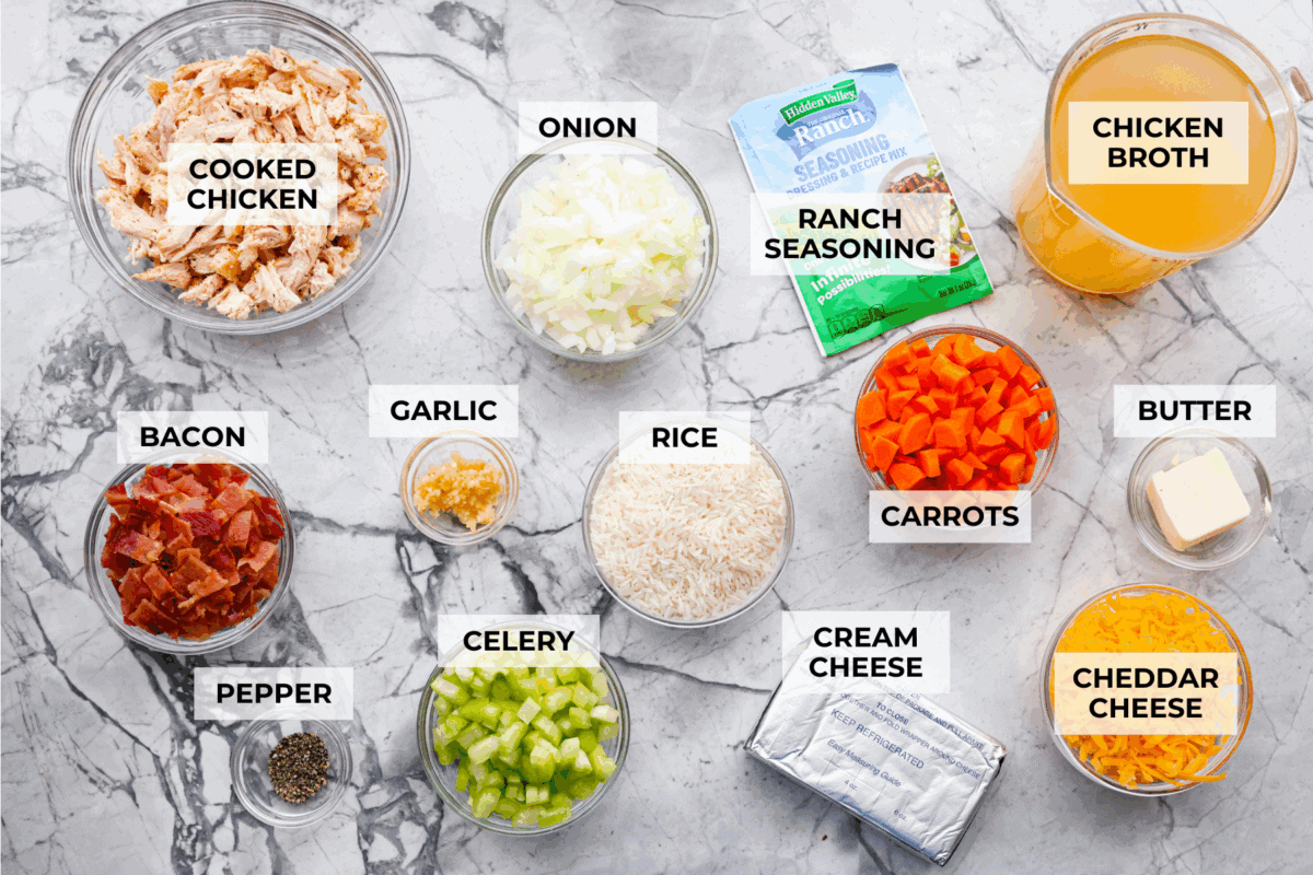 Stop what you are doing right now, and make this Crack Chicken and Rice soup! With tender chicken, rice, creamy cheese, crispy bacon, and bold ranch flavor, this easy one pot recipe tastes like pure comfort in every spoonful. Overhead shot of labeled ingredients.