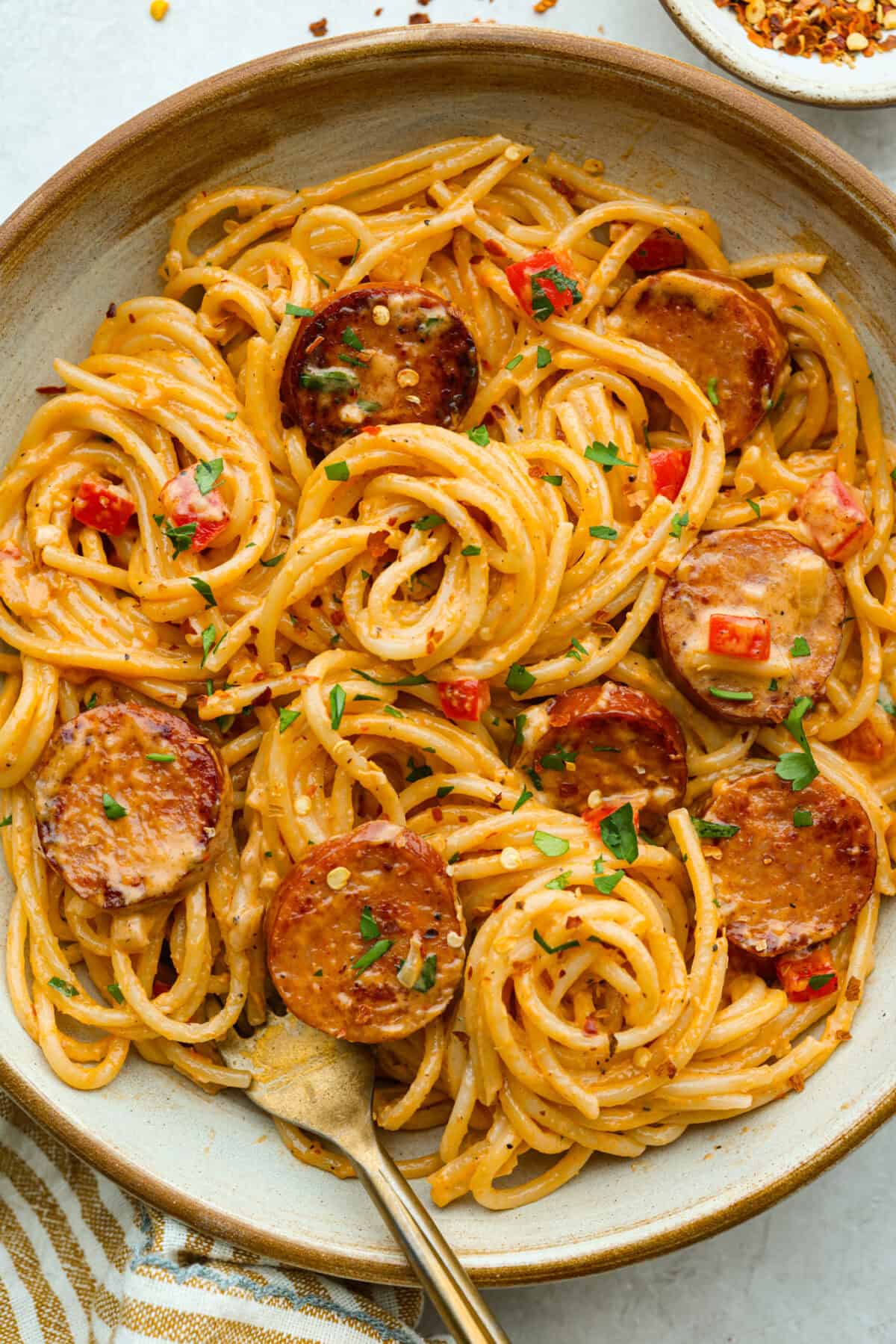 Plate of Cajun spaghetti with a fork.