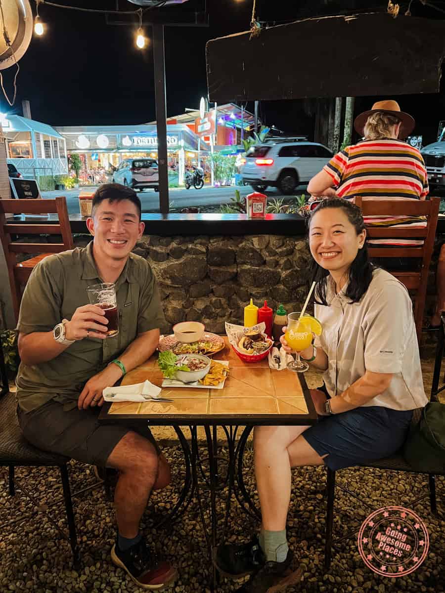couple having dinner at la fortuna pub in costa rica
