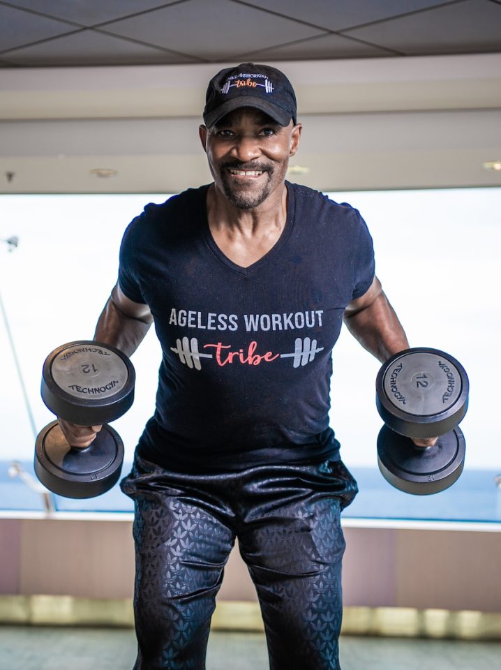 senior Black man lifting dumbbells