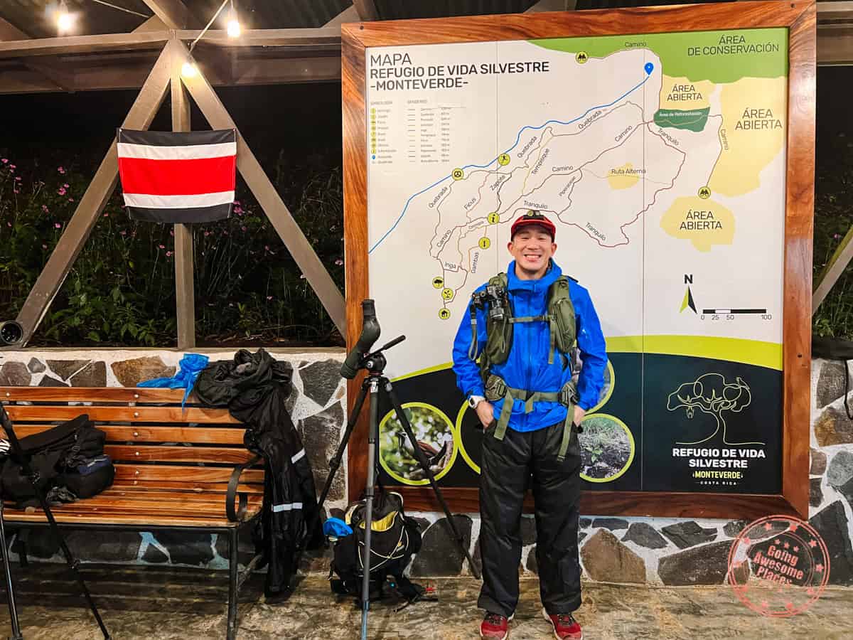 standing by map at wildlife refuge monteverde