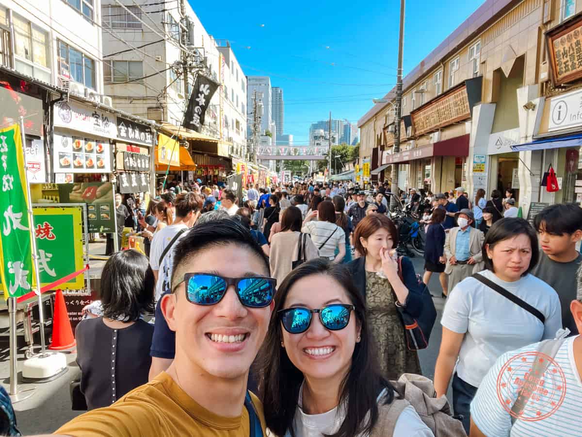 will and chantelle at tsukiji fish market in tokyo