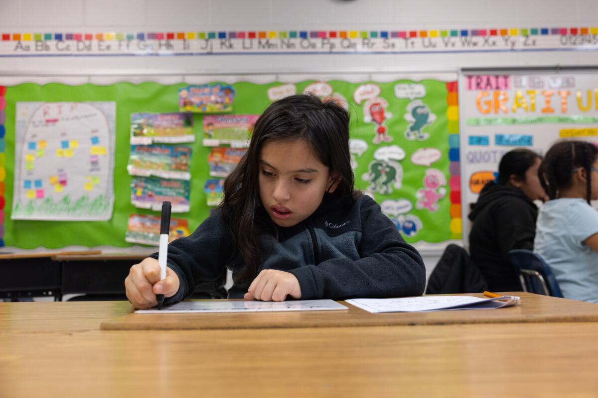 Antonio Benavides says his penmanship has improved since joining cursive club.