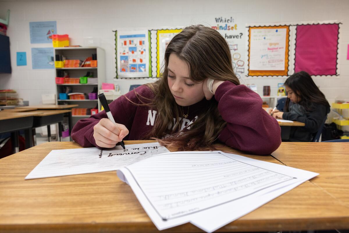 Conrad Thompson is proud of her cursive skills.
