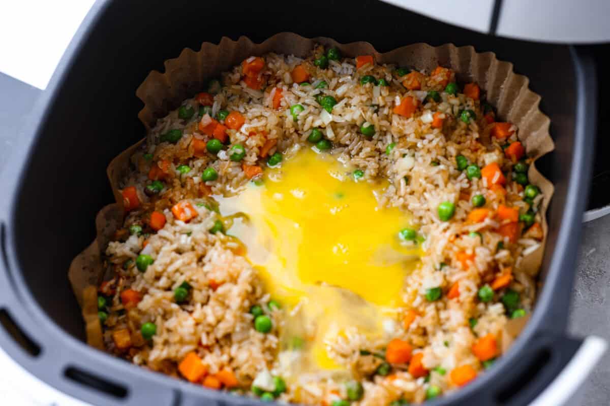 Did you know you can make fried rice in the air fryer? My Air Fryer Fried Rice recipe takes something already simple and makes it even easier. You get golden, slightly crispy rice, tender veggies, and the best flavor with hardly any effort. Eggs whisked together and poured on top of the cooked rice mixture.