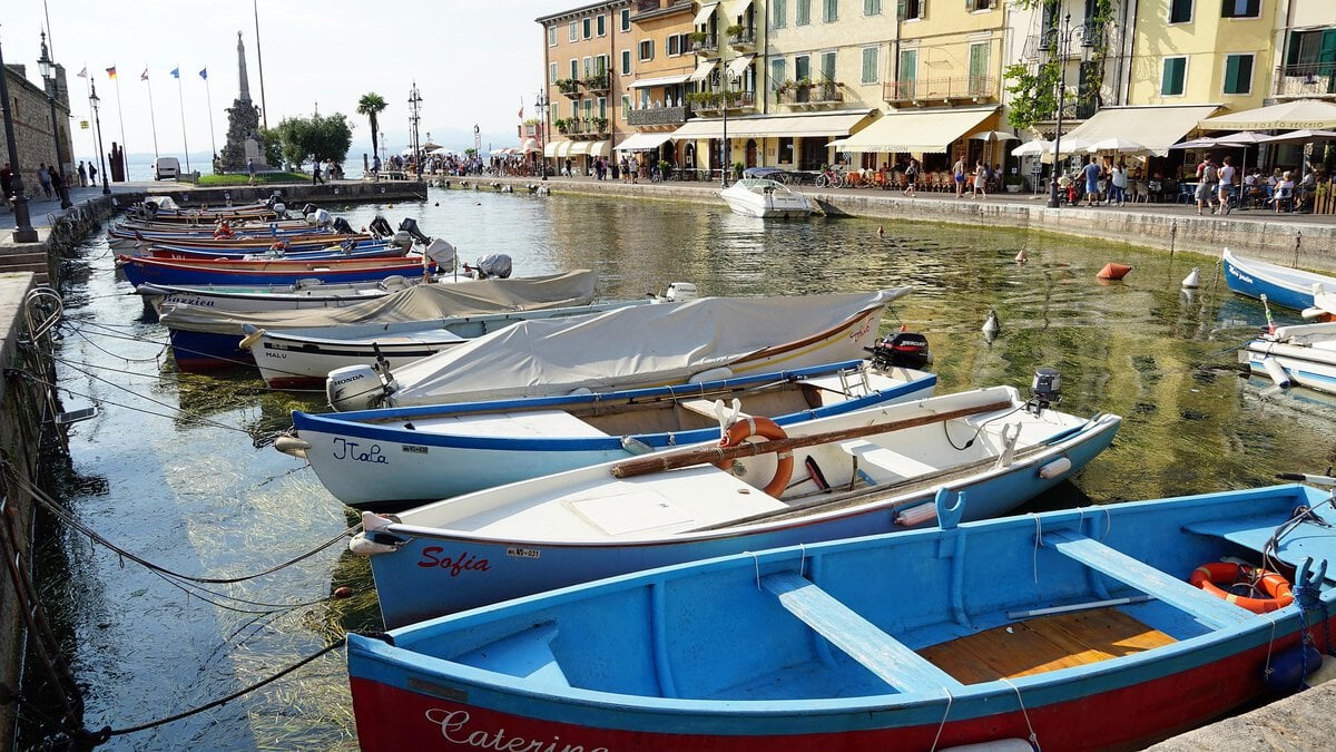 - Three Shores, One Lake: Finding Your Own Rhythm on Lake Garda Lazise harbor, Lake Garda, Italy.