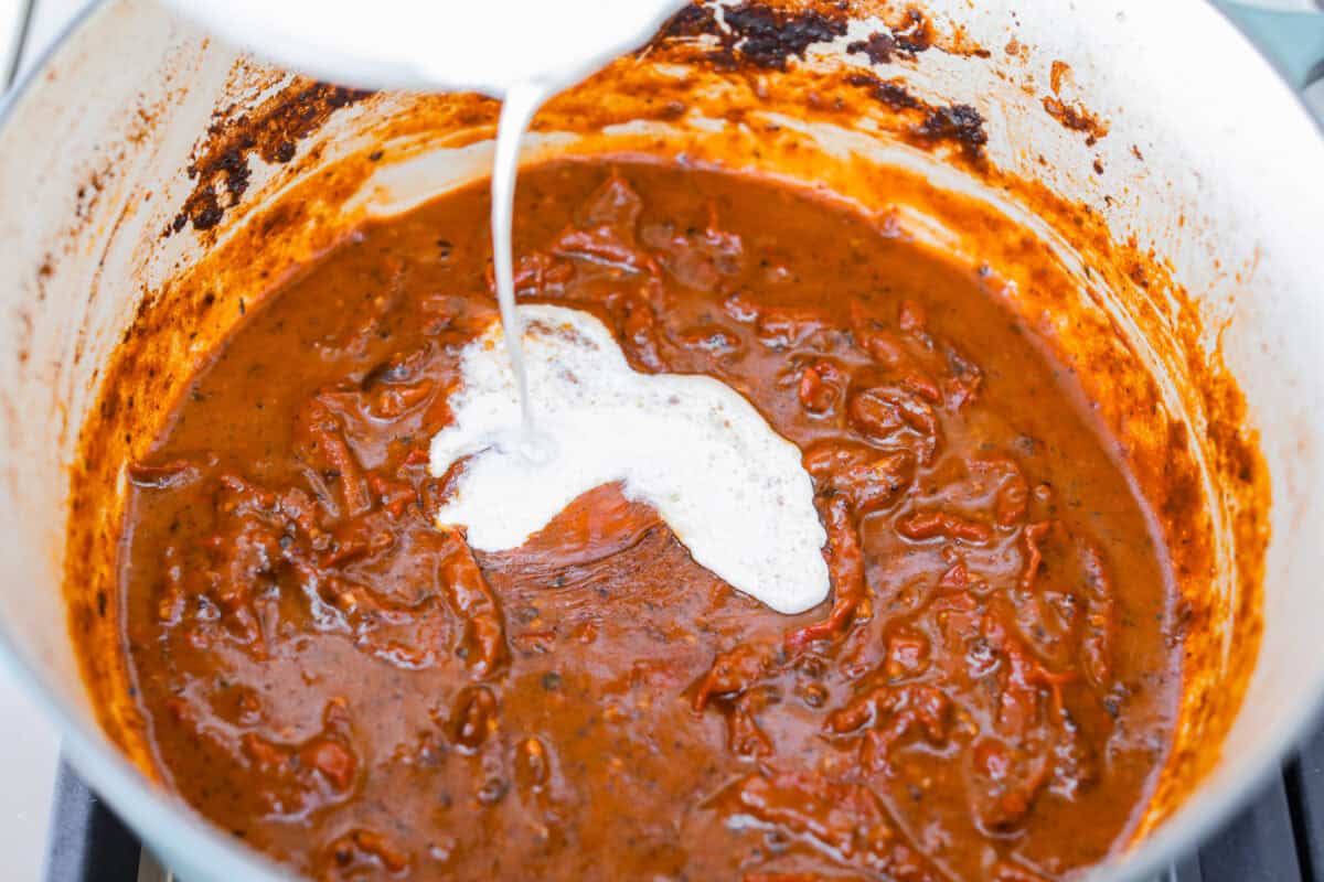 Cream and cheese mixture added to the dutch oven with the beef and velvety sauce.