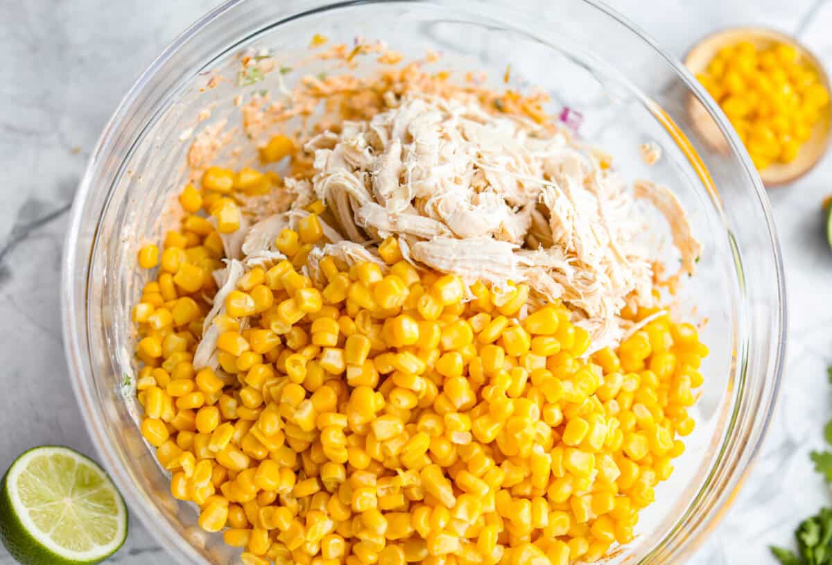 Corn and chicken added to the mixed up sauce ingredients.