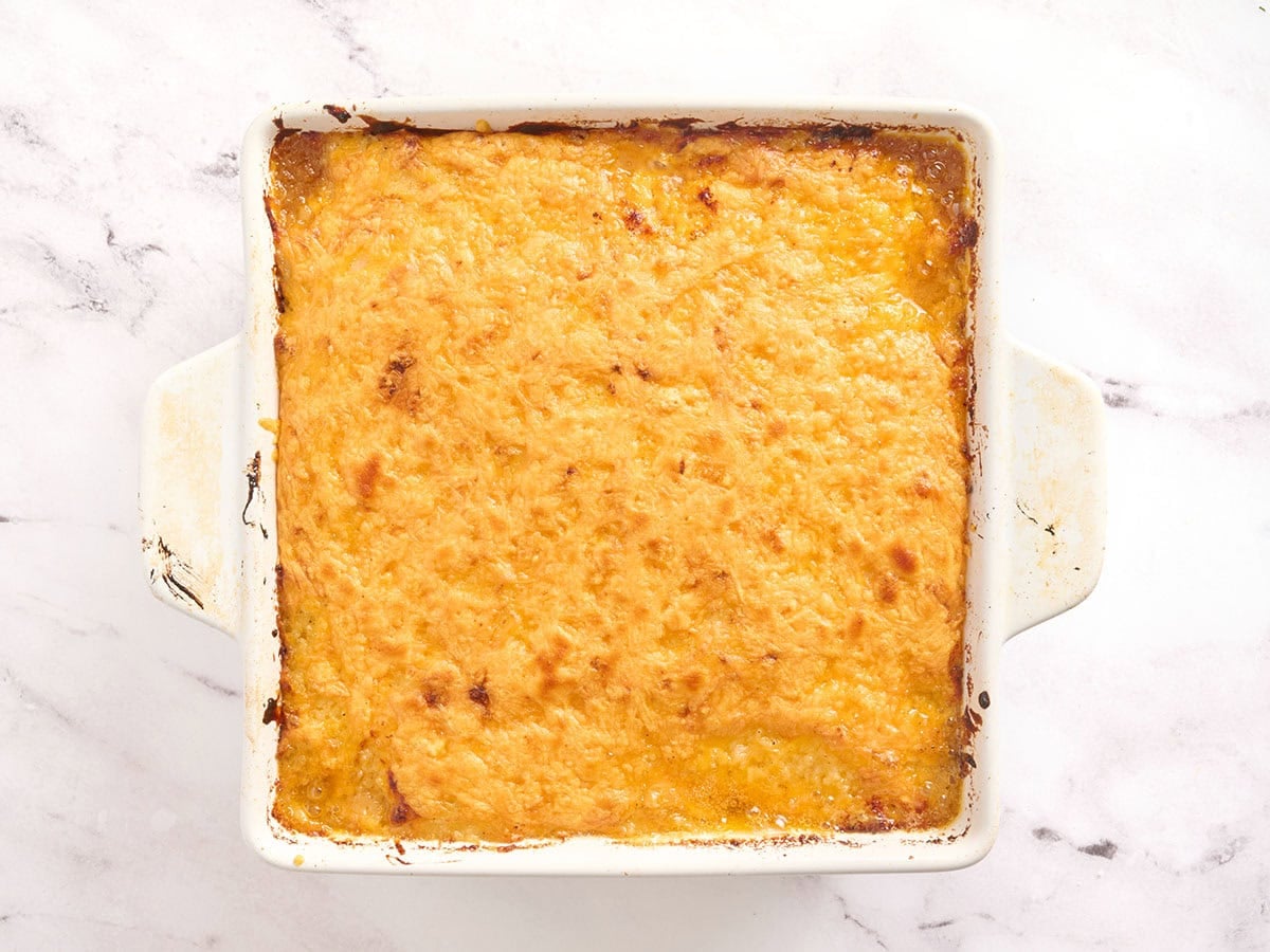 Meatloaf casserole after baking in the oven, covered in melted cheese.