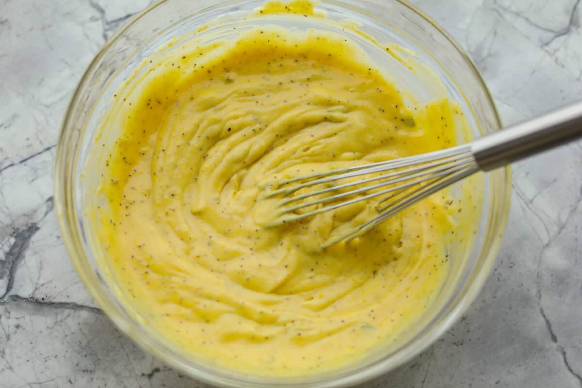 Bowl full of dressing ingredients.