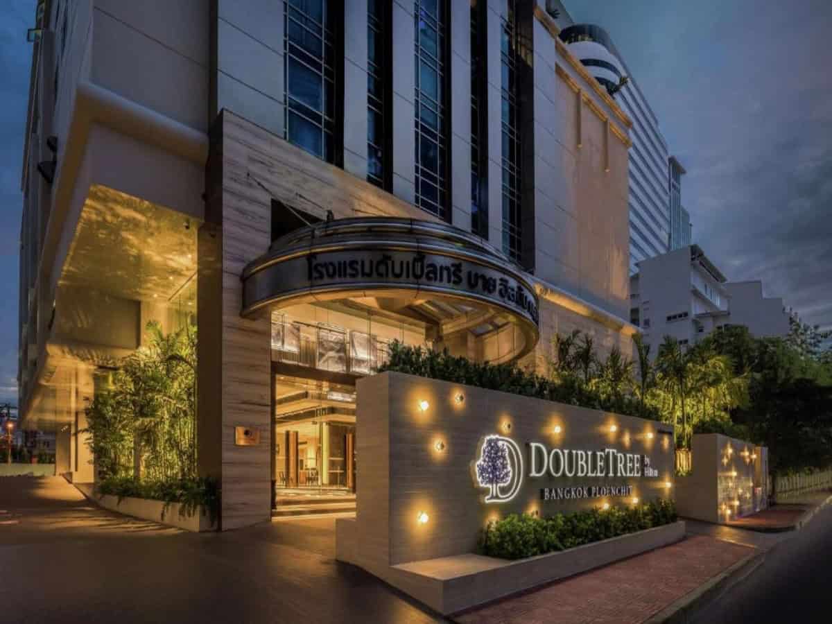 main entrance and front sign to doubletree by hilton bangkok ploenchit
