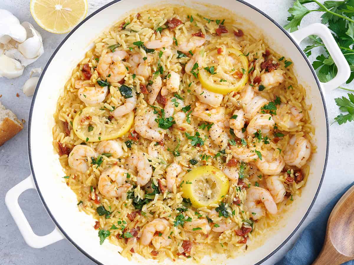 Overhead view of a garlic shrimp and orzo skillet.