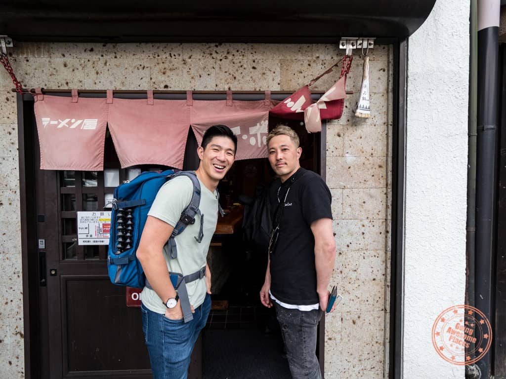 will from going awesome places with hiroshi of ramen beast in front of toybox in tokyo