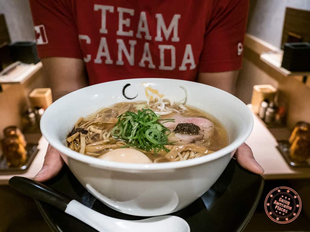 ramen konjiki hototogisu shoyu ramen bowl in hand