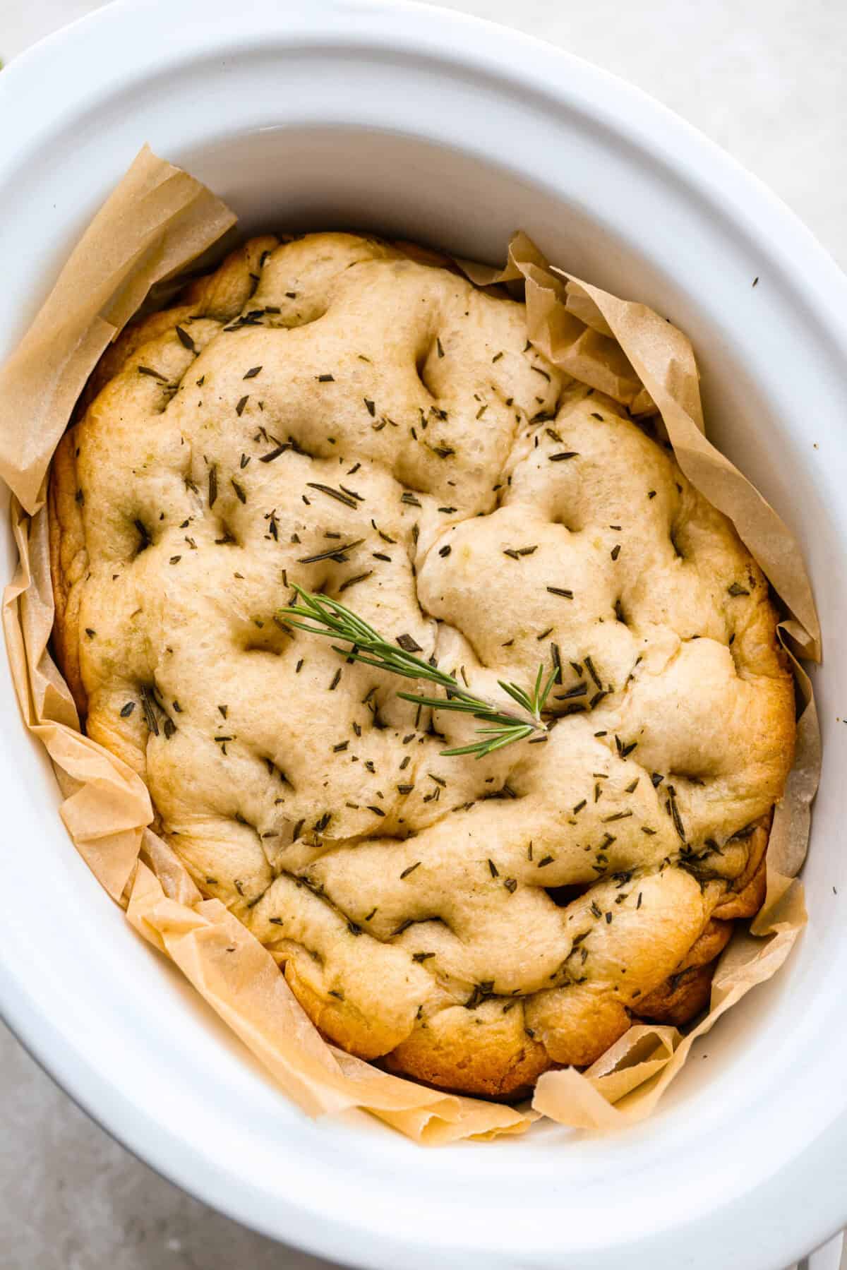 Image of the slow cooker focaccia bread in the crockpot.