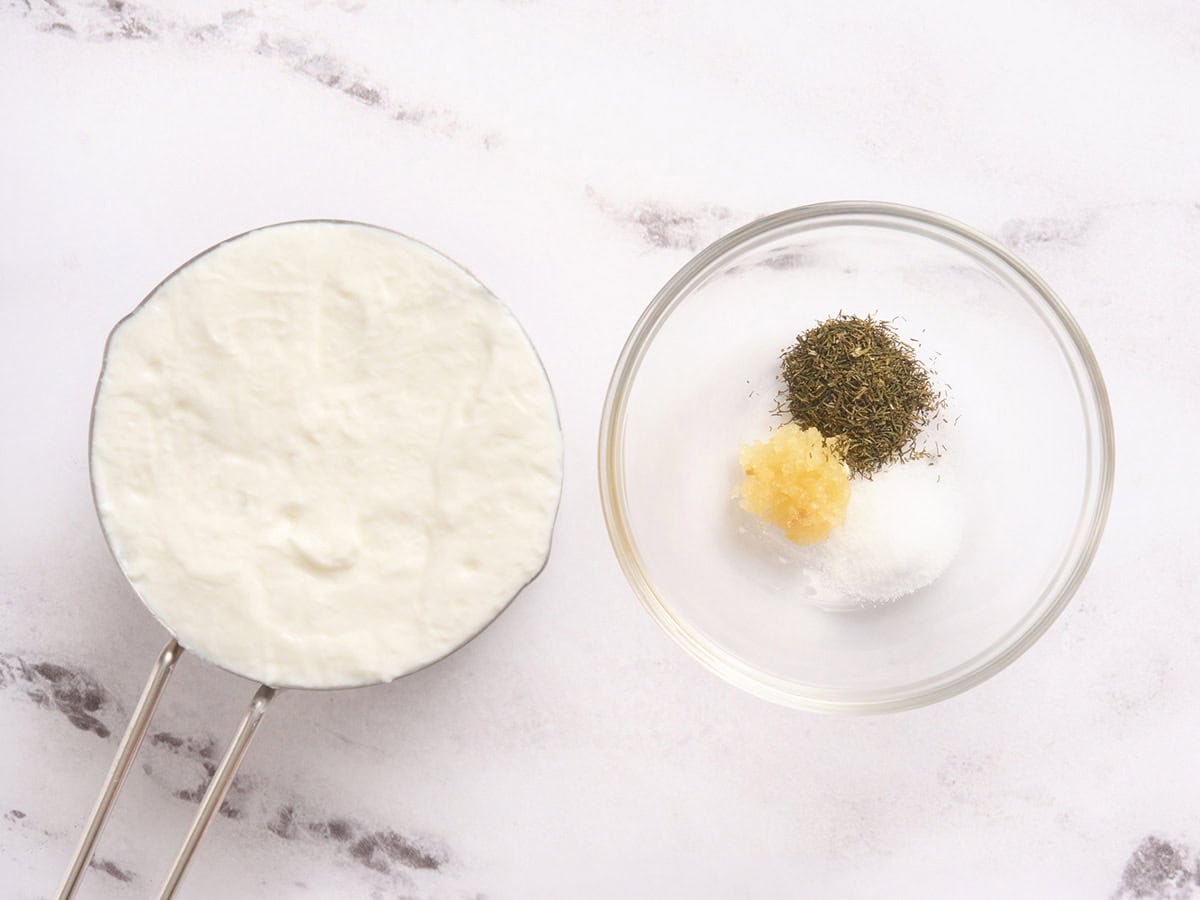 The ingredients to make a yogurt sauce to serve with chicken shawarma.