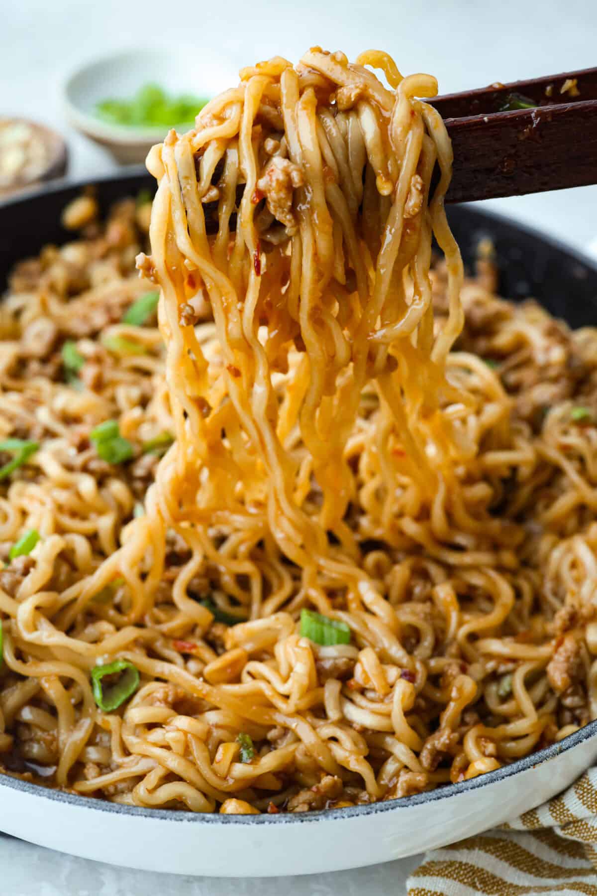 Meat and sauce mixture combined with the cooked dragon noodles.