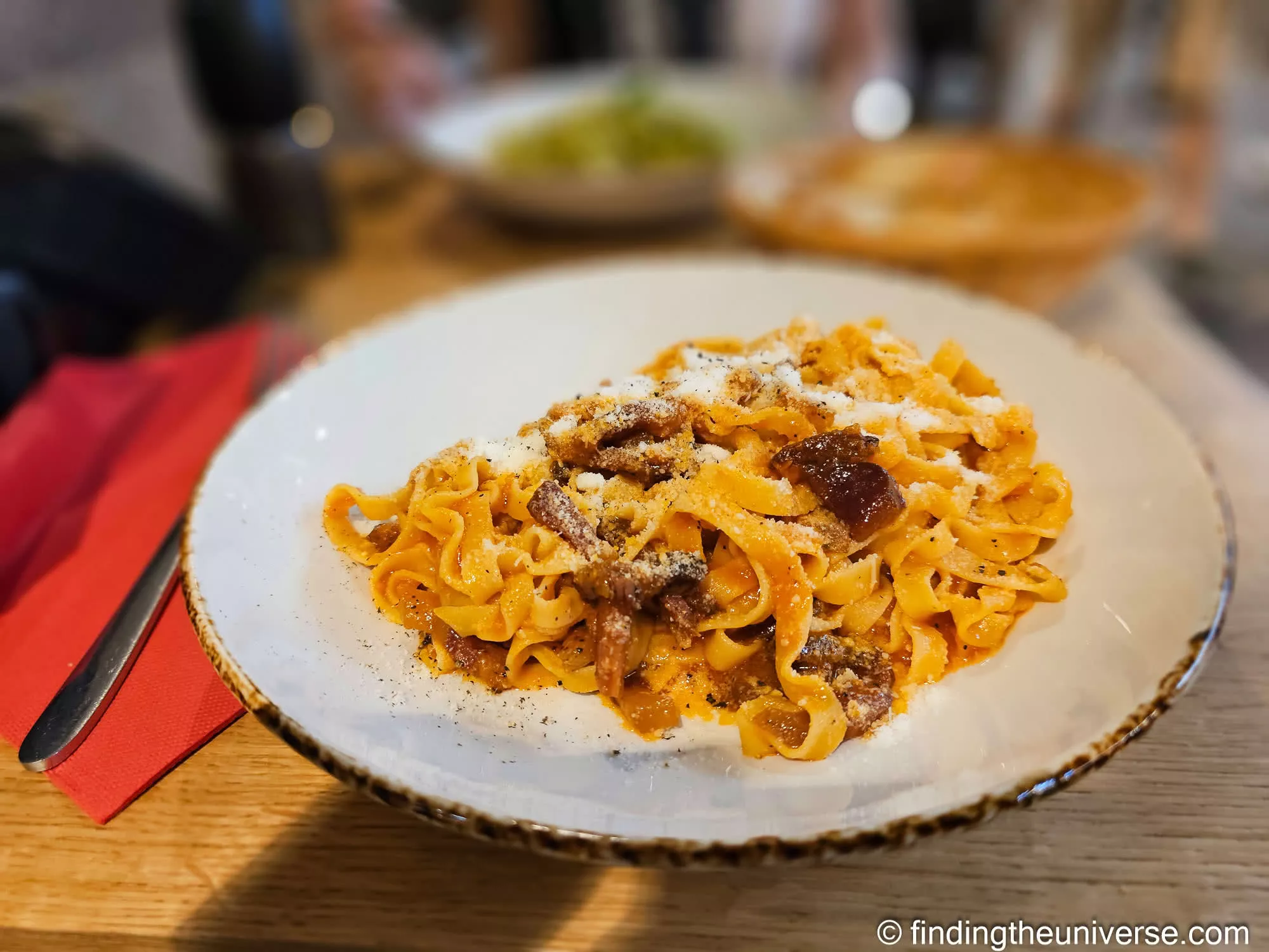 A plate of fresh pasta from a stall in the Sotto il Salone food market under the Palazzo della Ragione, Padua
