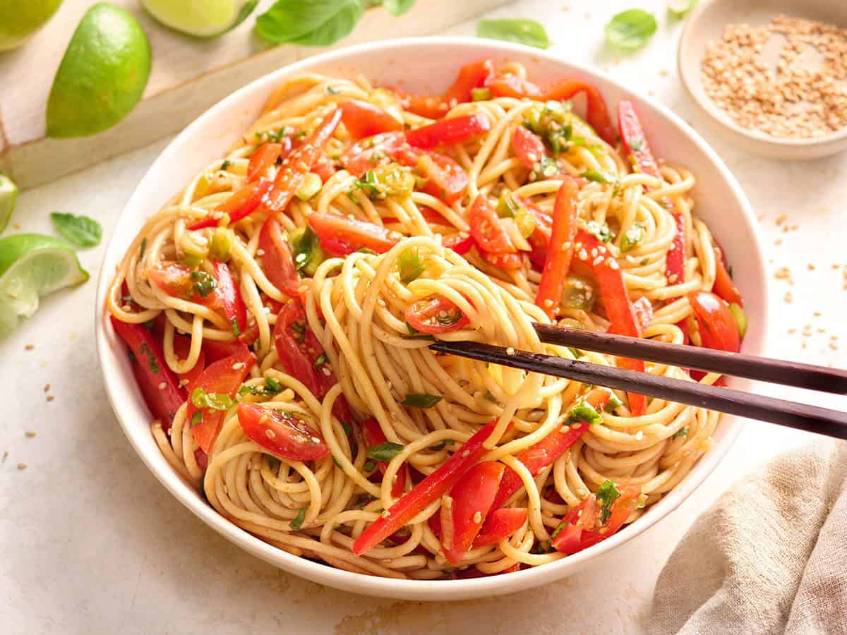 Side view of a bowl of cold sesame noodles.