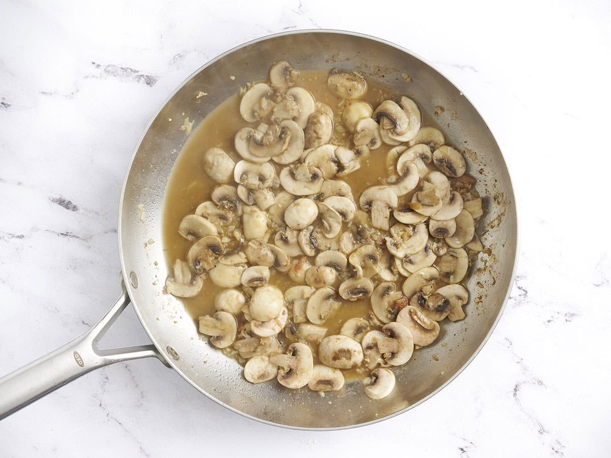 Mushrooms in a skillet after being sauteed.