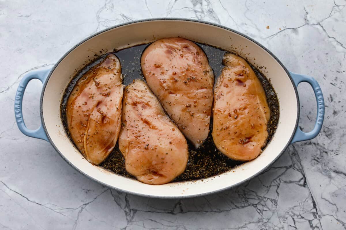 Juicy chicken, melty mozzarella, tomatoes, basil, and balsamic glaze all baked in one pan. Easy, fresh, and so good. Chicken breasts flipped over to cover them entirely with sauce.