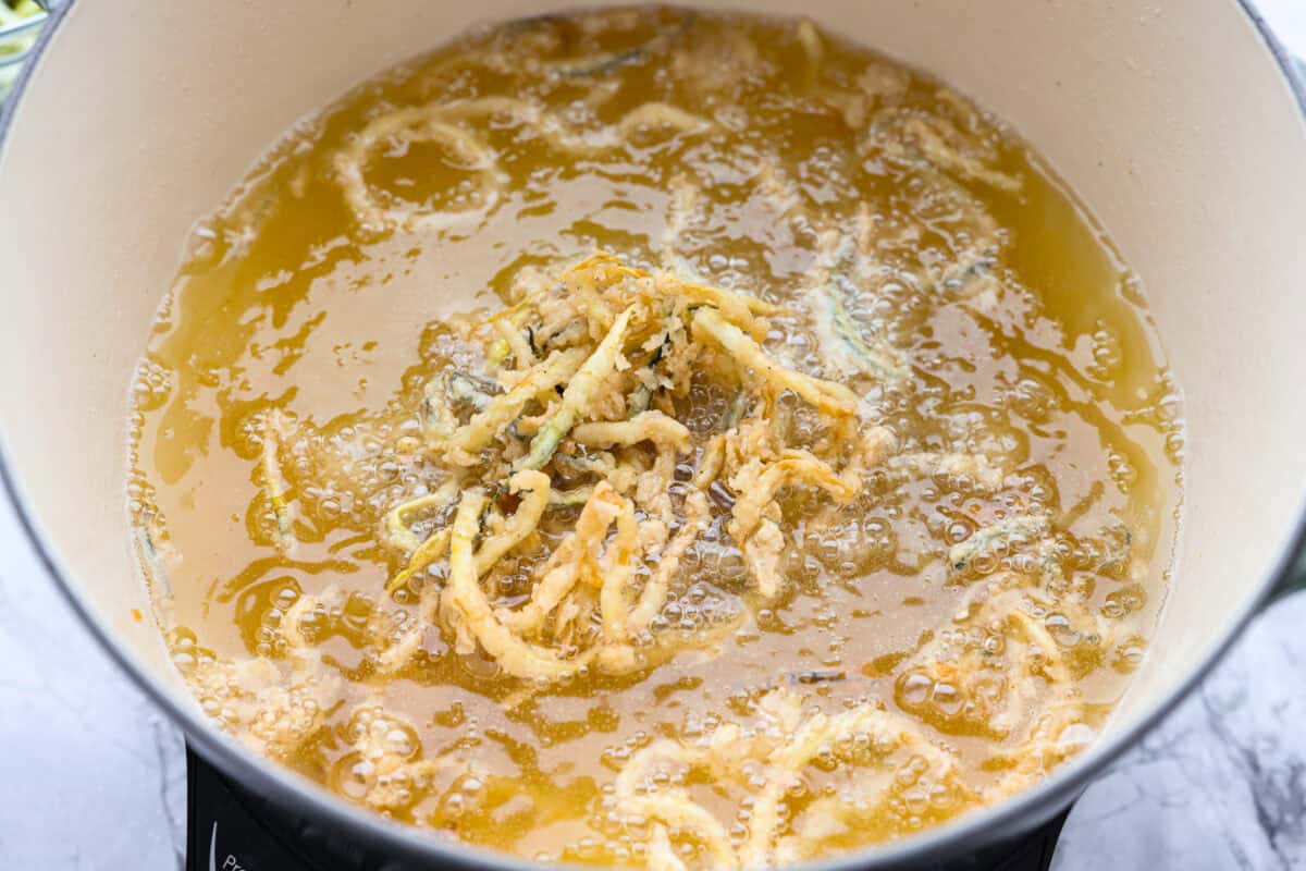 Strings frying in oil.