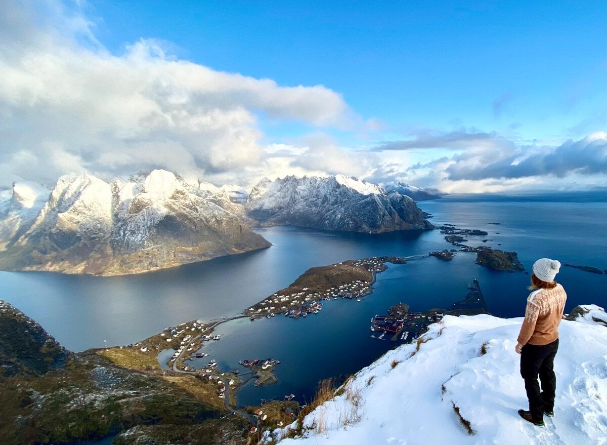 northern norway trip - A Guide to Exploring the Outdoors of Northern Norway Woman at the top of Reinebringen in Lofoten, Northern Norway