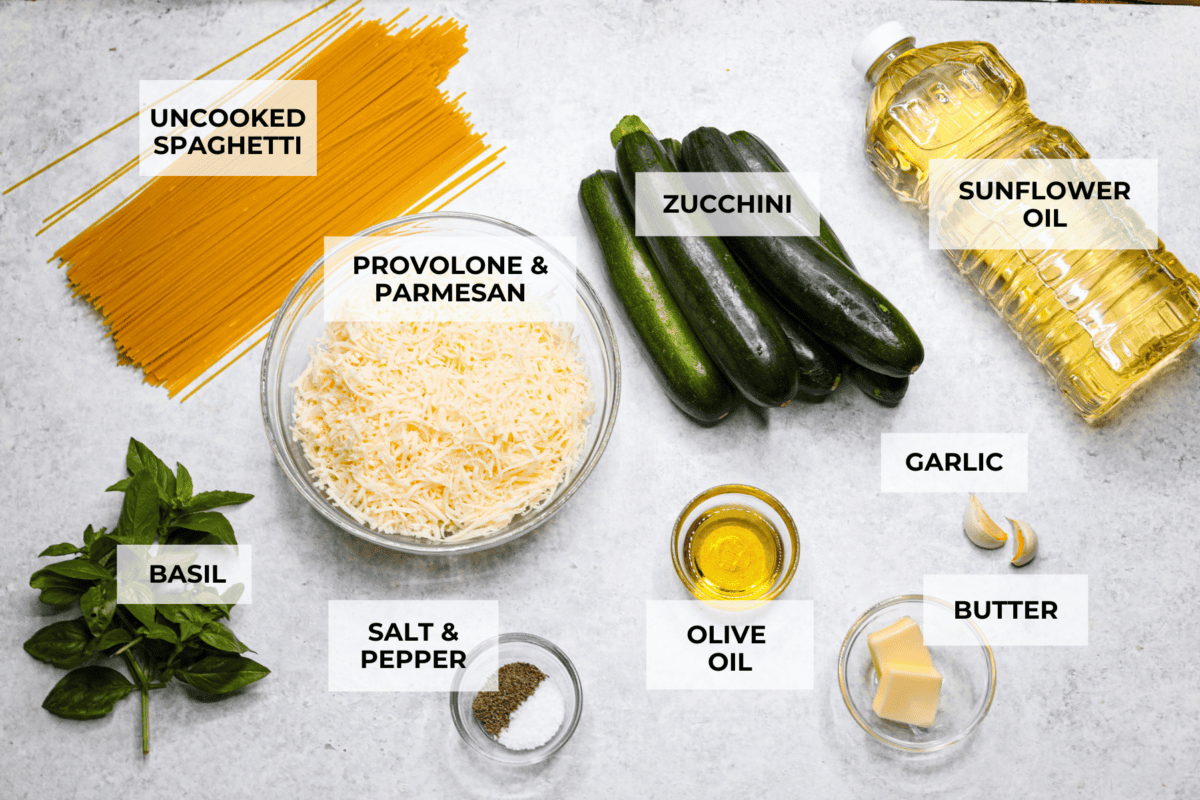 Spaghetti alla Nerano is an unforgettable pasta dish packed with flavor! It has a rich and creamy zucchini sauce infused with garlic, fresh basil, and melted cheese. Ingredients labeled to make spaghetti alla Nerano.