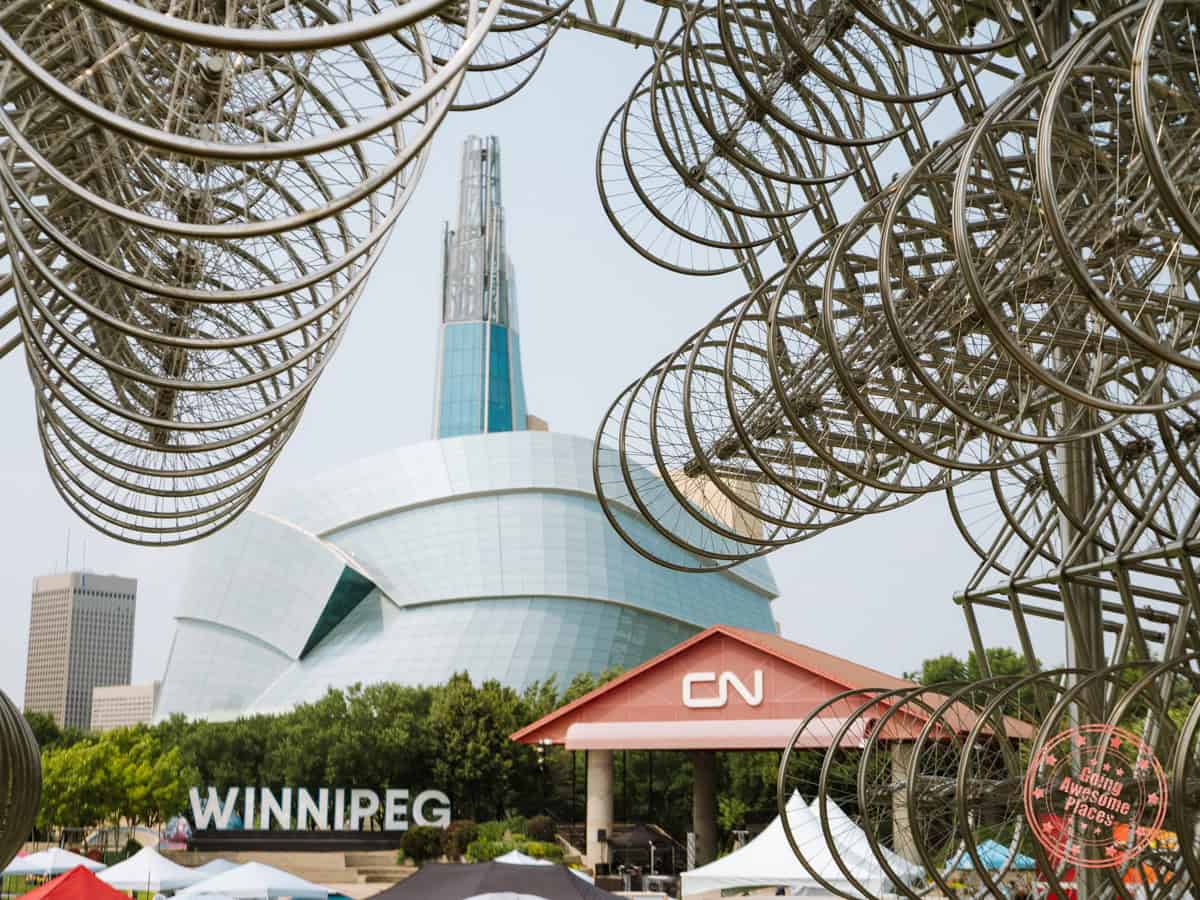winnipeg sign with canadian museum for human rights with forever bicycles public art in the foreground